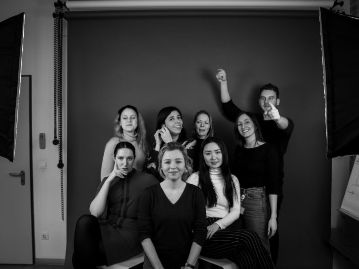 A group of people against a dark background