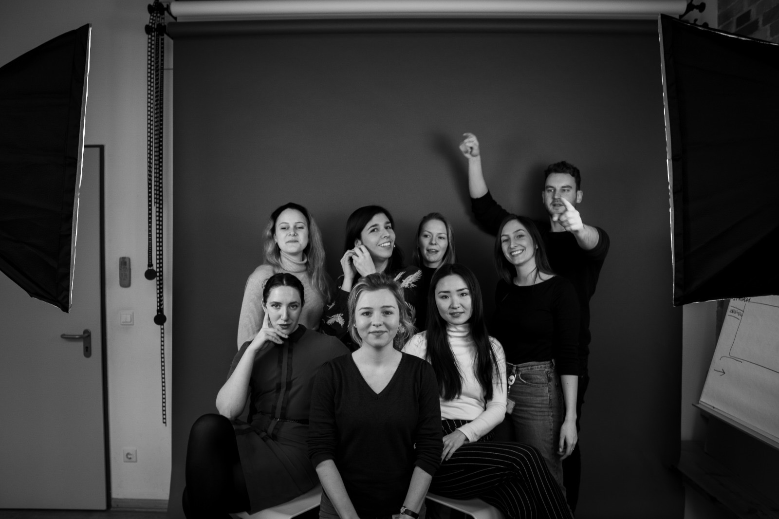 A group of people against a dark background