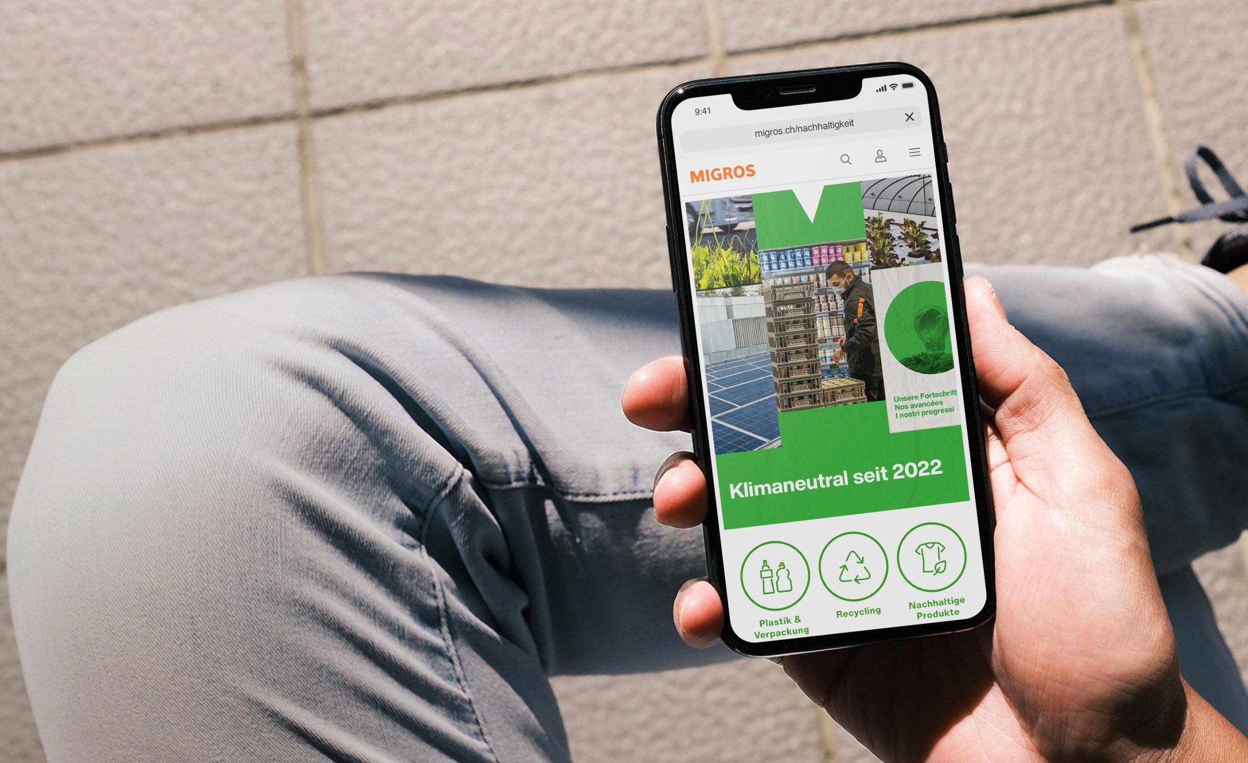 Smartphone screen with teaser of the Migros sustainability hub