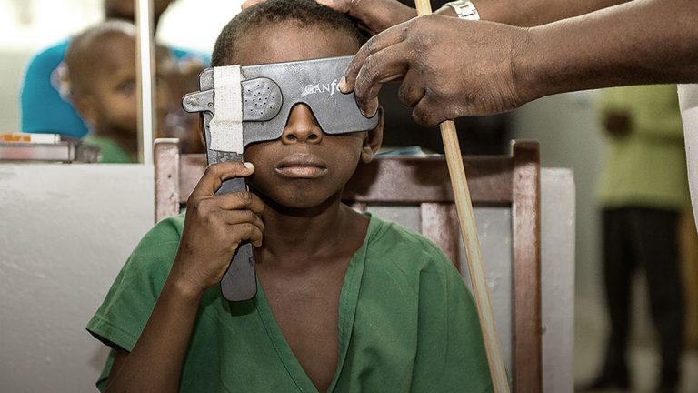 Picture of a child during an ophthalmic screening examination