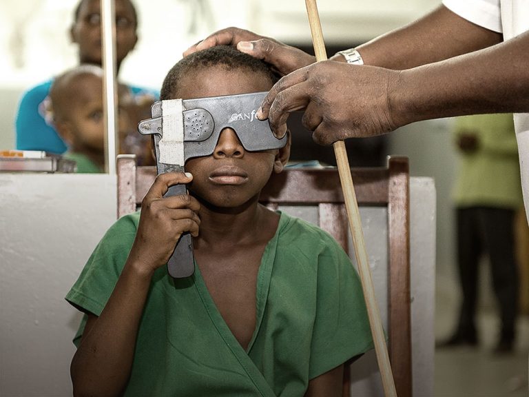 Picture of a child during an ophthalmic screening examination