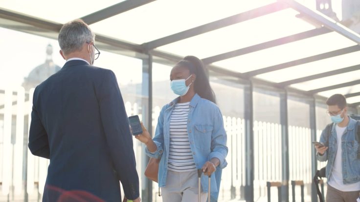 CovPass-Check App woman airport man