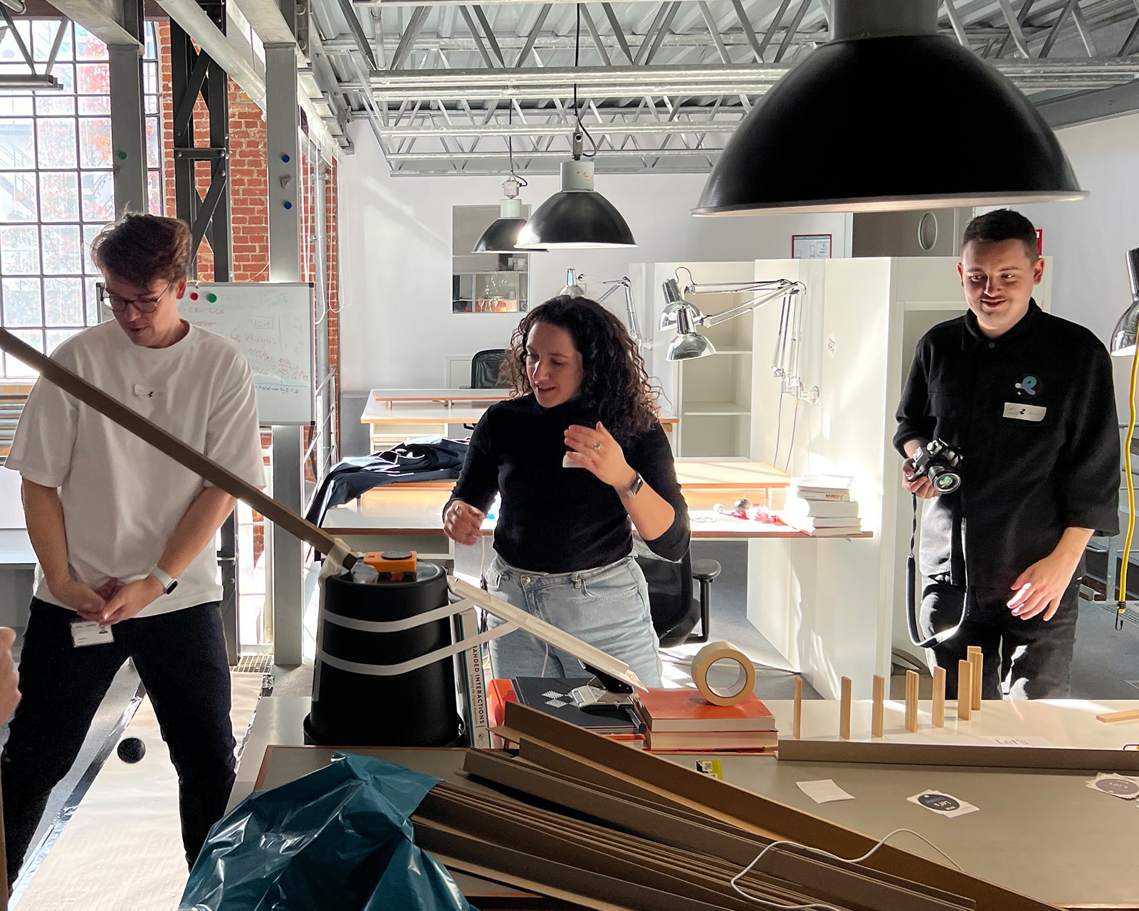 Three people work on one project in the office