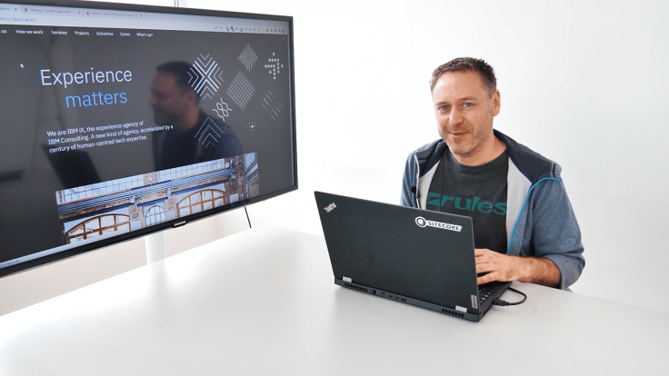 Christian Handel sitting in front of a Laptop