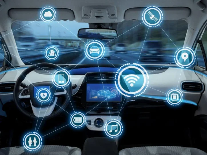 An illustration showing a futuristic vehicle surrounded by digital code, symbolizing the concept of Software-Defined Vehicles.